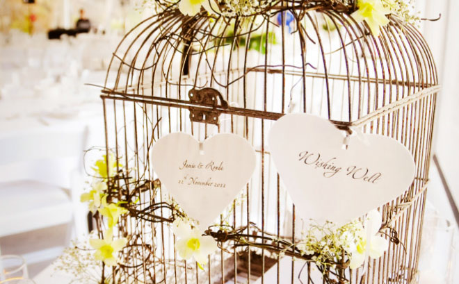 Skip the traditional wishing well for a vineentwined birdcage